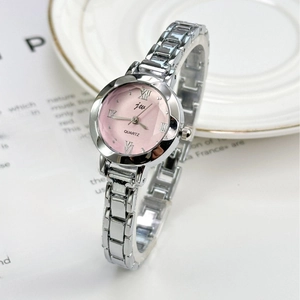 Elegant silver quartz watch with pink dial and Roman numerals on white ceramic