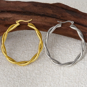 Close-up of twisted rope texture 304 stainless steel hoop earrings in gold and silver