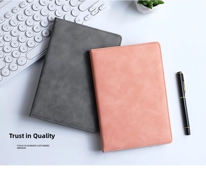 Detail view of A5 PU leather business notebooks with fine stitching in grey and pink