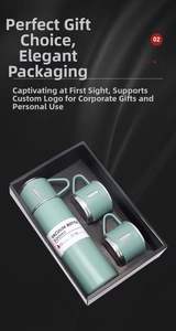 Detail of mint green 500ml vacuum flask set with two matching handle cups in gift box