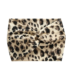 Classic leopard print wide headband with twisted knot design in soft stretch fabric
