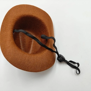 Detail of brown felt mini cowboy hat showing inner structure and adjustable elastic cord