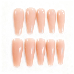 Macro shot of 10-piece nude pink long coffin press-on nails with a glossy jelly finish