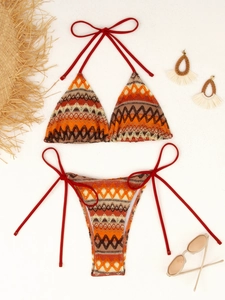Detail of bohemian crochet bikini with zigzag patterns, halter neck, and side ties