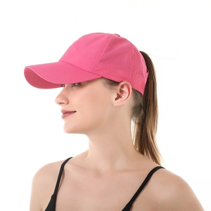 Detail of rose red ponytail baseball cap showing side mesh ventilation and hair opening