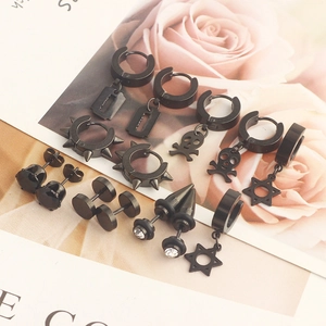 Detail of 7 pairs black stud earrings set with cross, skull, and cubic zirconia charms