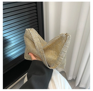 Detailed view of the sparkling gold and silver rhinestones on the luxury hobo bag