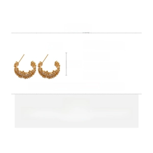 Detail showing dimensions of golden C-shaped zircon earrings with silver pins