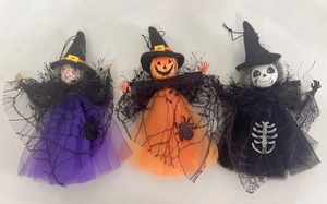 Detail of Halloween hanging ghosts featuring gauze fabric, witch, pumpkin and skull designs