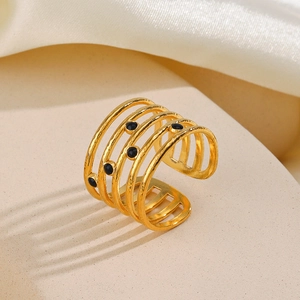 Gold-plated five-layer hammered ring with black enamel dots in an open adjustable style