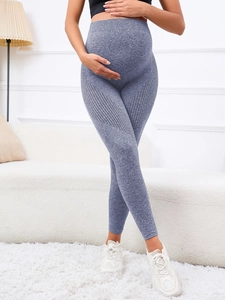 Detail view of high-waist maternity yoga leggings in grey-blue with breathable side mesh