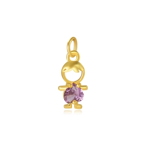 Macro shot of gold boy pendant with purple heart-shaped cubic zirconia gemstone