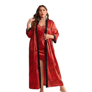 Red satin heart print pajamas set with two pieces: a long robe and a matching slip dress