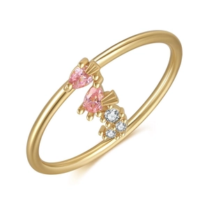 Detail of 18K gold seahorse ring featuring pink pear-shaped stones and clear cubic zirconia