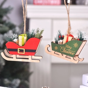 Christmas wooden sleigh ornaments with pine cones and mini trees hanging on a festive tree