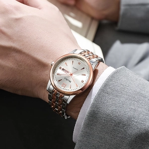 Montre homme quartz style business avec calendrier et bracelet en acier bicolore doré