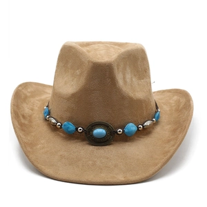 Detail of camel suede cowboy hat featuring turquoise stones and vintage metal beads