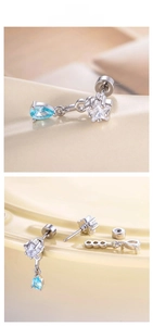 Macro detail of star zircon and blue teardrop pendant with threaded earring post screw back
