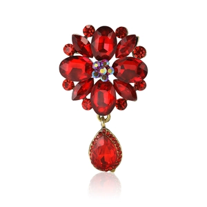 Elegant red flower brooch with rhinestone crystals and teardrop pendant on white background