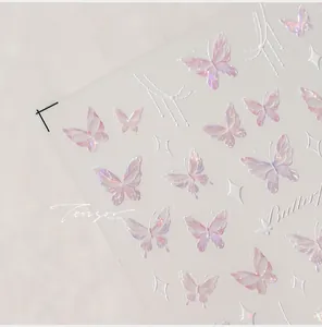Macro view of ultra-thin adhesive nail stickers with iridescent pink purple butterflies