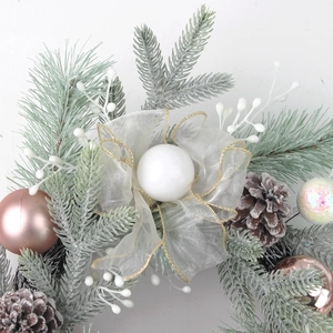 Christmas wreath with pine needles, cones, berries, and pink decorative balls