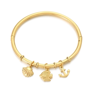 18K gold plated ocean charm bangle with sea shell, fish, and anchor charms for women