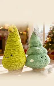 Close-up of plush Christmas tree dolls with shiny star toppers and soft green faux fur