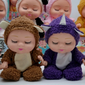Close-up of assorted 8-inch sleeping BJD dolls in bear and unicorn plush outfits