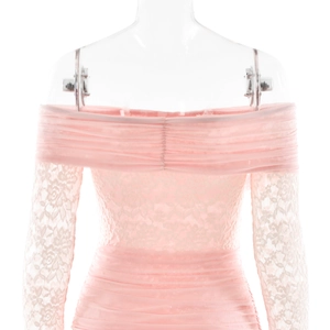 Detailed view of pink off-shoulder dress featuring floral lace sleeves and mesh ruching