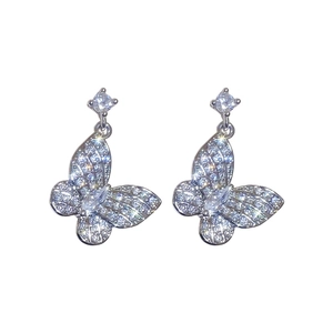 Sparkling silver butterfly drop earrings set with clear zircon stones on a white background
