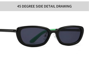 Detailed 45-degree side view of vintage oval sunglasses with black frame and green accents
