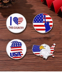Set of four USA Independence Day metal badges with red and blue enamel on wood table