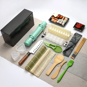 Flat lay of 17-piece DIY sushi making kit with bamboo mats and stainless steel tools
