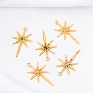 Detailed view of eight-pointed star charms with colorful natural stone inlays on white silk