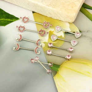 Pink heart and moon nipple rings set in 316L stainless steel on natural stones