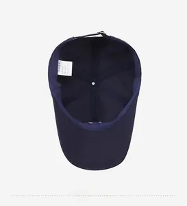 Interior detail of navy cotton baseball cap showing lining and quality stitching