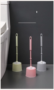 Close-up of long handle toilet brush set with funnel base in green pink and grey