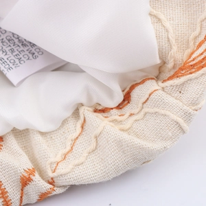 Short embroidered jacket with beige woven fabric, orange embroidery and soft inner lining