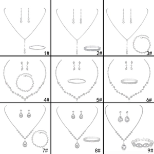 Nine silver bridal jewelry sets with necklaces and earrings in zirconia droplet designs