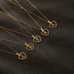 Gold plated stainless steel necklace with black heart pendant featuring Old English letters