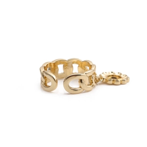 Gold chain ring with daisy flower pendant and sparkling zircons in a minimalist style