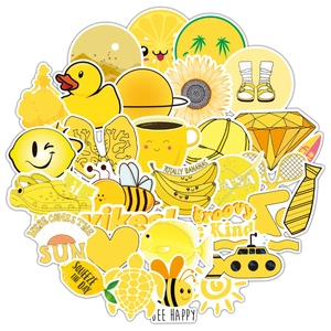 Flat lay of yellow VSCO vinyl stickers featuring a lemon, banana, and sunflower motifs