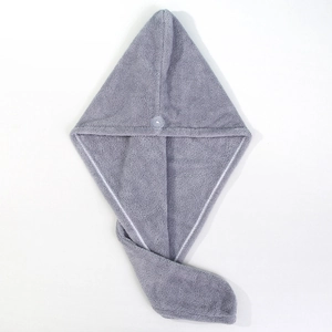 Detail view of the gray coral fleece hair towel featuring a secure button closure and texture
