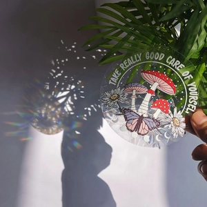 Rainbow prism suncatcher sticker with mushroom and butterfly reflecting light