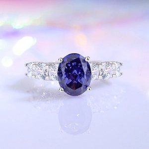 Classic S925 silver ring featuring oval blue gemstone and round white zircon accents