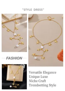 Detailed view of gold starfish charms and white round pearls on Y-shaped chain necklace