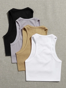 Detailed flat lay of four rib-knit nylon yoga tanks in black, lilac, khaki and white