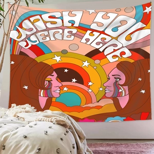 Detail of retro psychedelic tapestry featuring Wish You Were Here text on a white wall