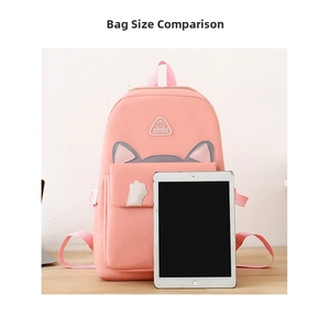 Pink cat-themed backpack compared to a tablet to show its large storage capacity