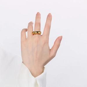 Detail of 18k gold plated dome ring with a high polished finish on model hand
